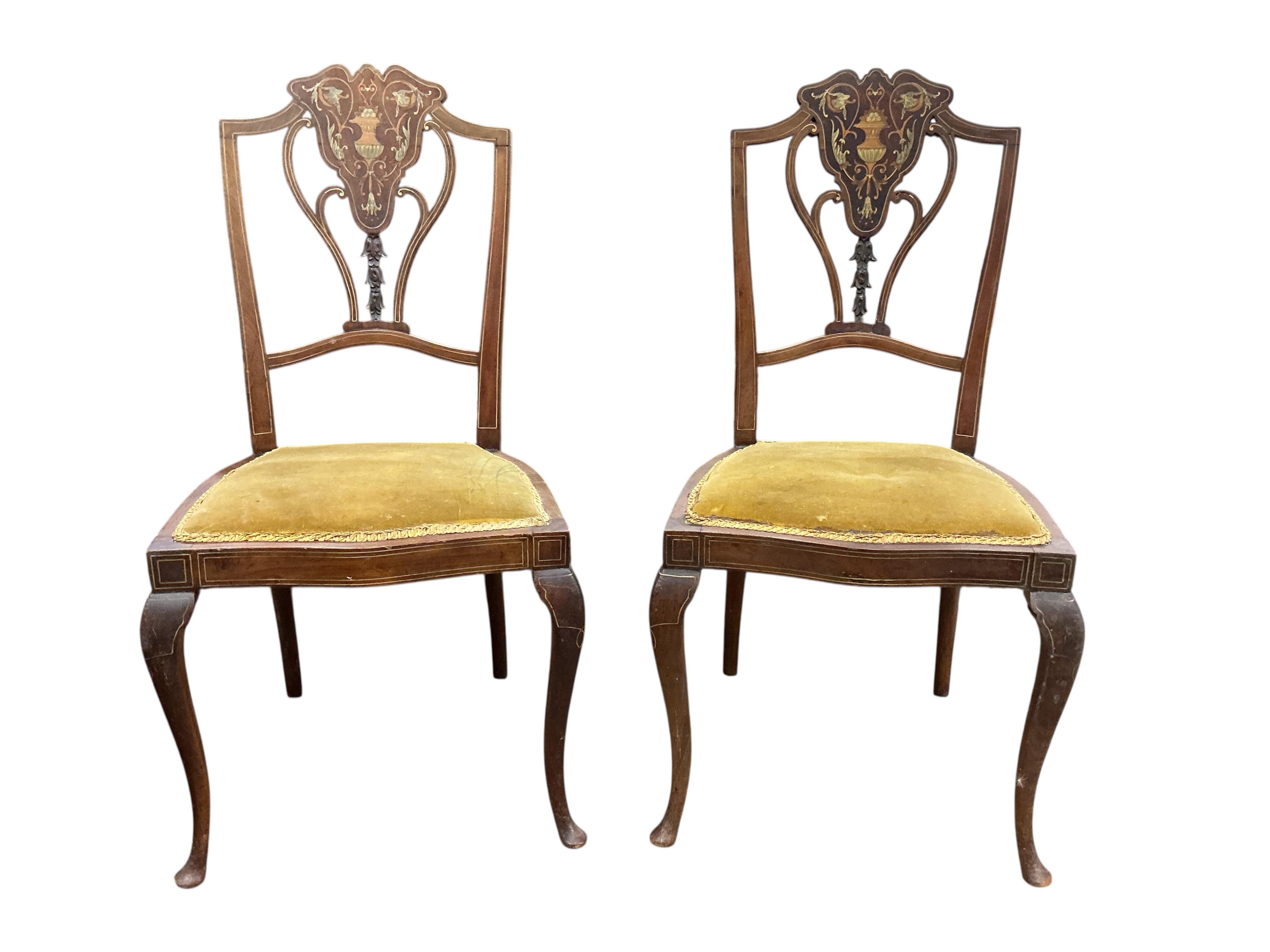 A set of eight Edwardian marquetry inlaid mahogany dining chairs, two with arms